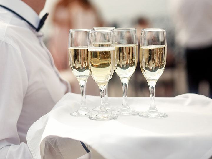 Glasses of sparkling wine on a tray
