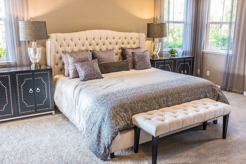 The Olive Room: Upholstered king bed and linen drapes