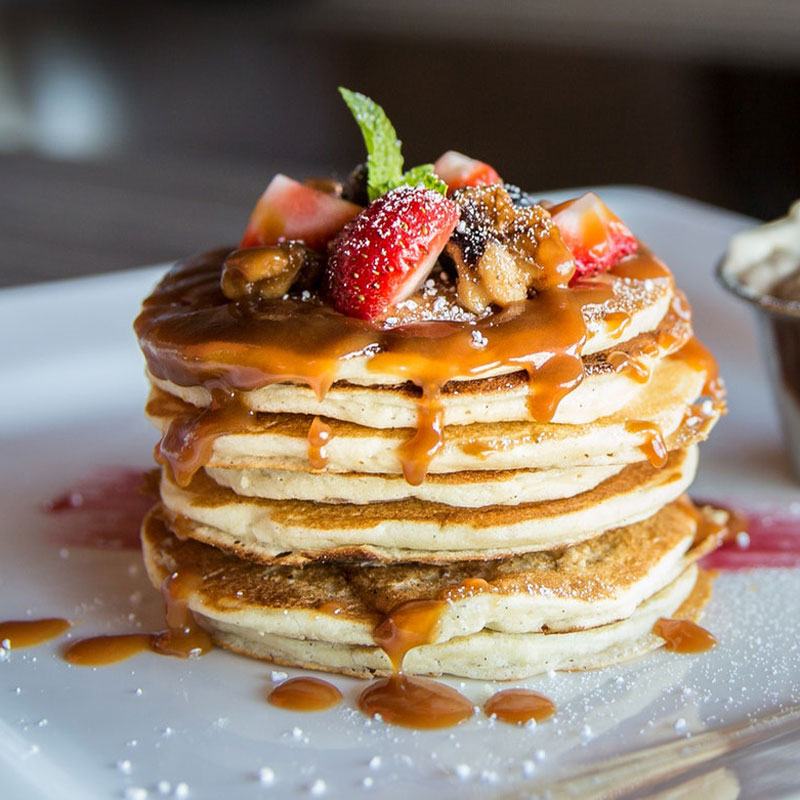 Stack of ricotta pancakes with strawberries